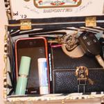 check out everything that will fit in the purse... phone, lipstick, keys, wallet 
